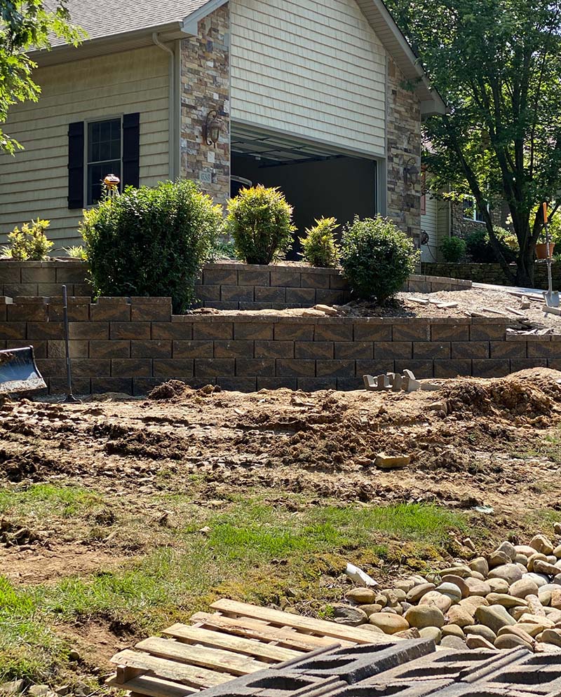 Hardscape project - retaining wall around side of house garage.