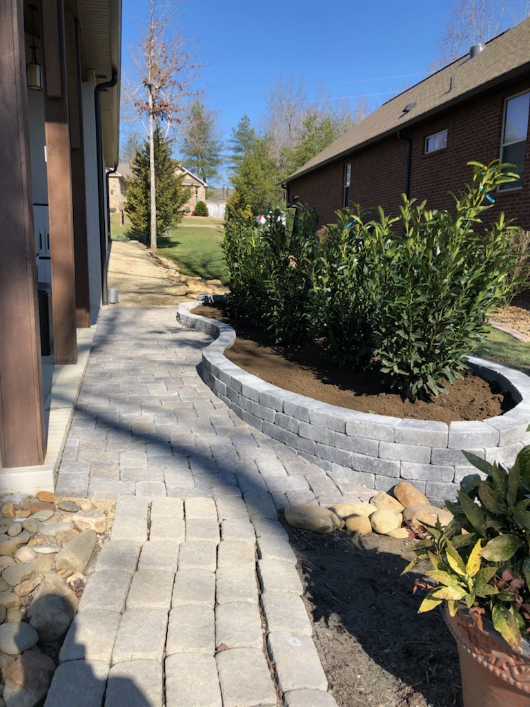 stone sidewalk and planting area